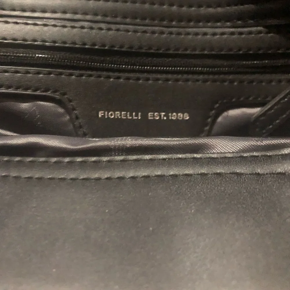 Fiorelli Abbey women’s handbag. Zipper and buckle accents. Detachable strap